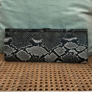 Le chateau snakeskin clutch